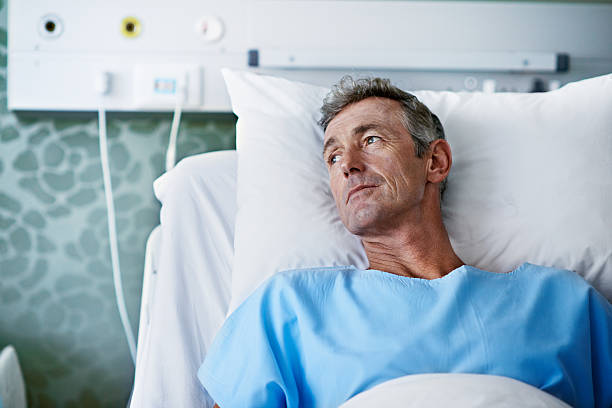 Shot of a sick man lying in a hospital bed